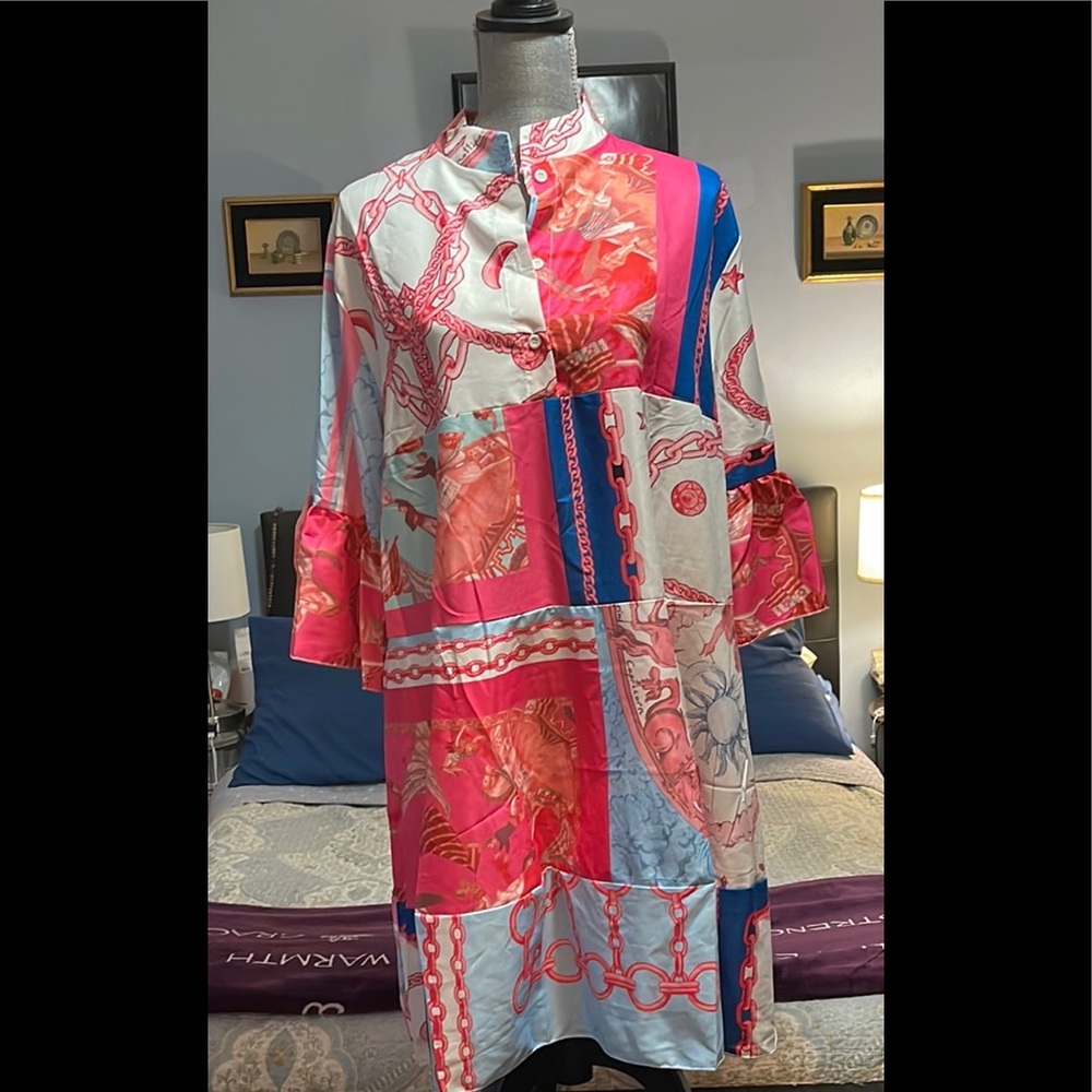Colorful Dress with 3/4 length sleeves. 100% Polyester. Primary colors.